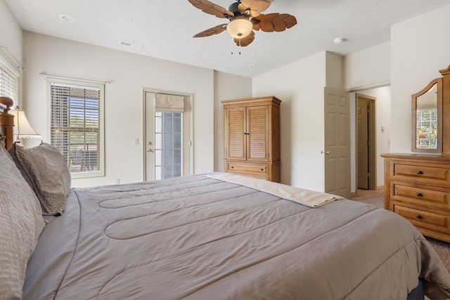 carpeted bedroom with access to outside and ceiling fan