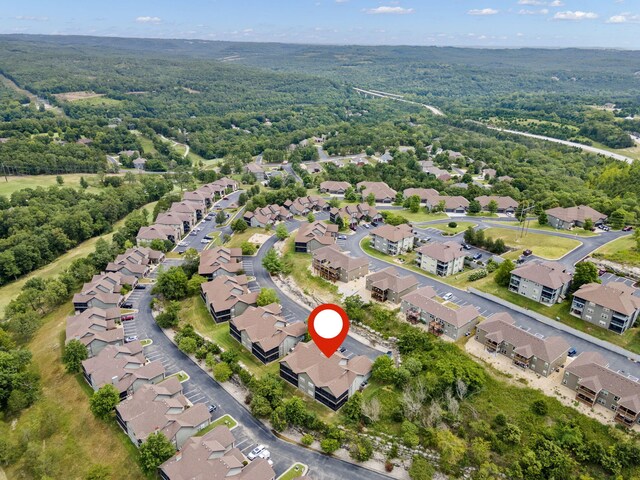 drone / aerial view with a view of trees and a residential view