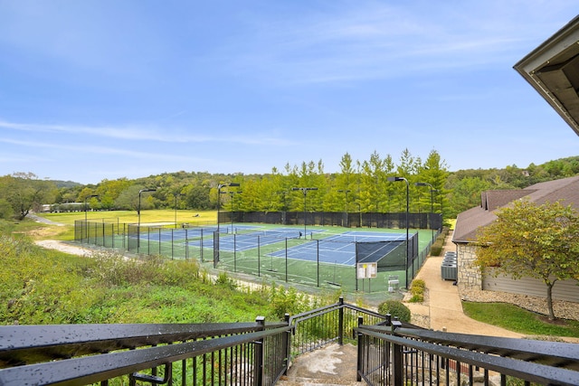 view of tennis court with fence