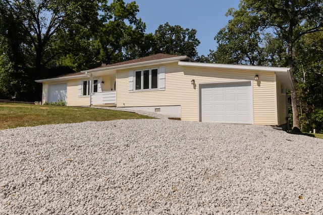 single story home with a garage