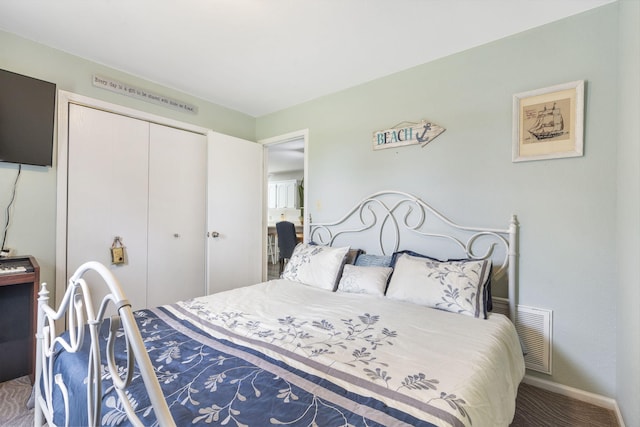 carpeted bedroom featuring a closet