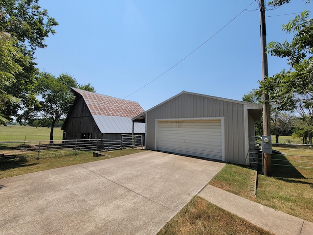 garage featuring a lawn