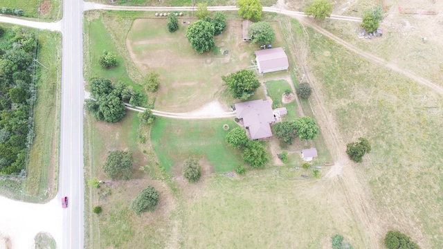 birds eye view of property with a rural view