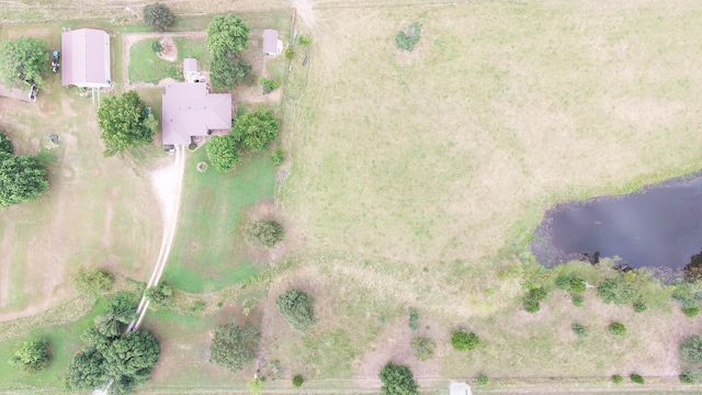 birds eye view of property featuring a rural view and a water view