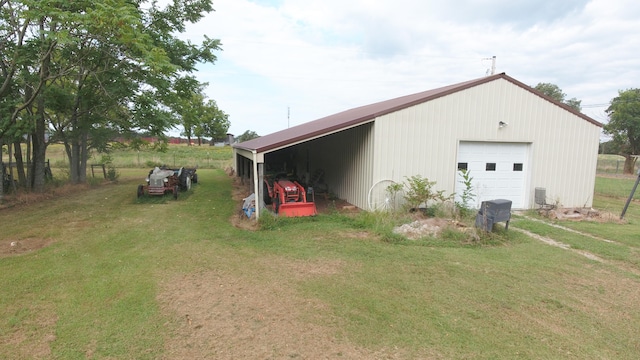 exterior space featuring a garage and a lawn