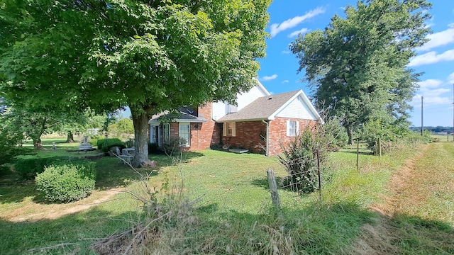 view of property exterior featuring a yard