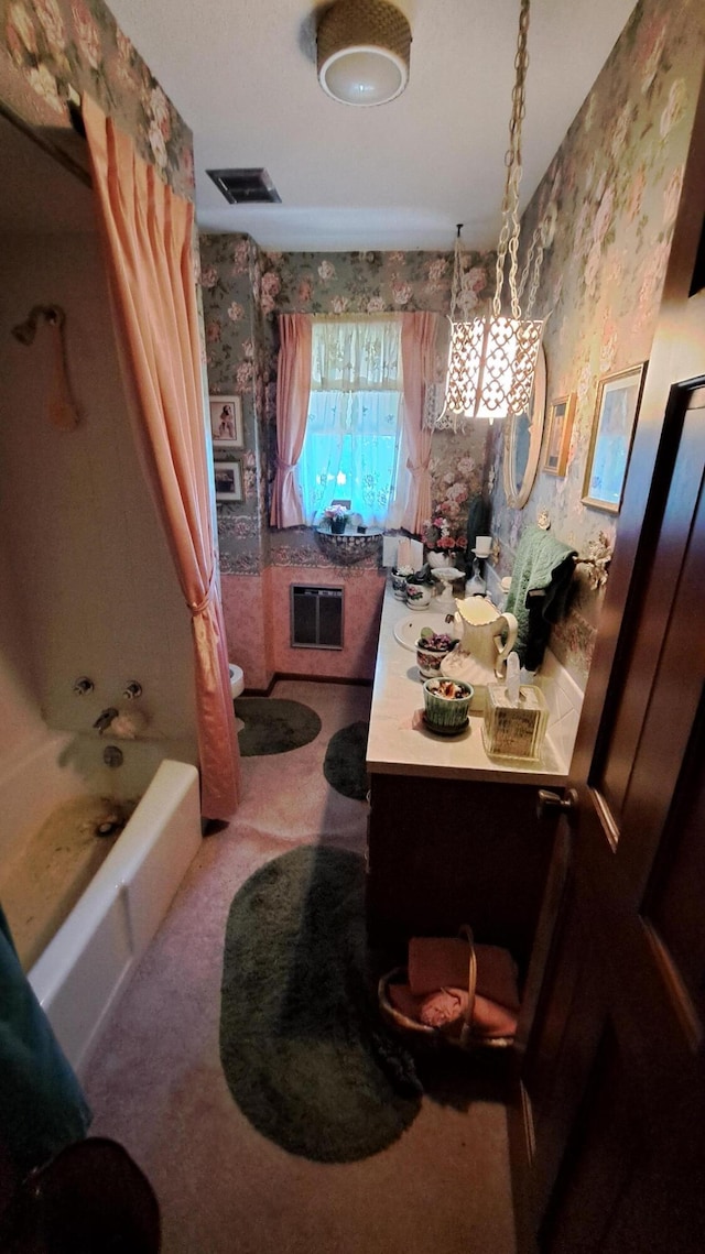 bathroom featuring shower / bathtub combination with curtain and vanity