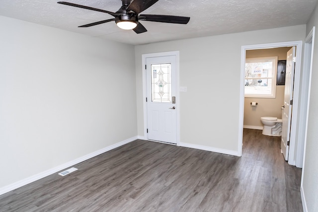 500 E Lincoln St, Buffalo, MO 65622 - foyer entrance featuring a ceiling fan, a healthy amount of sunlight, wood finished floors, and visible vents