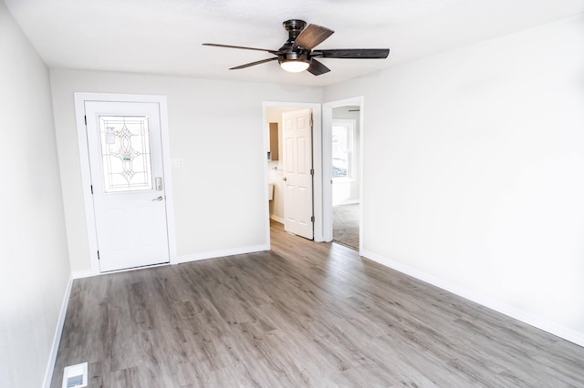 unfurnished room featuring hardwood / wood-style flooring and ceiling fan