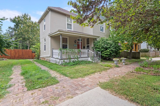 view of front facade featuring a porch and a front yard