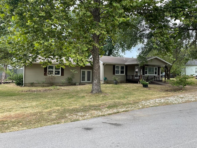 view of front of home with covered porch and a front yard