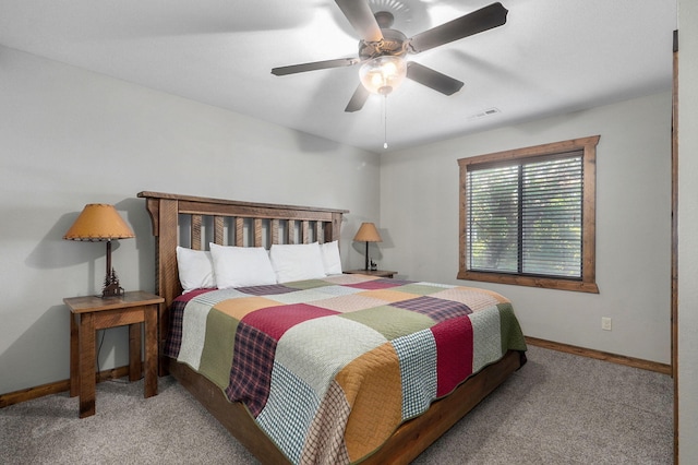 bedroom featuring ceiling fan and light carpet