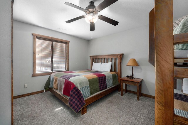 bedroom with light colored carpet and ceiling fan