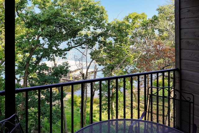 balcony featuring a water view