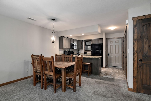 view of carpeted dining area