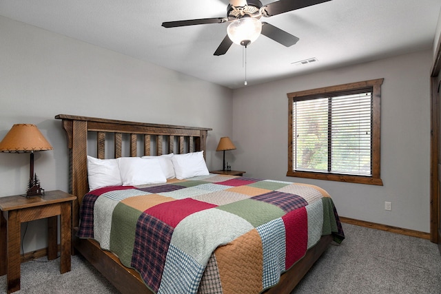 bedroom with ceiling fan and carpet