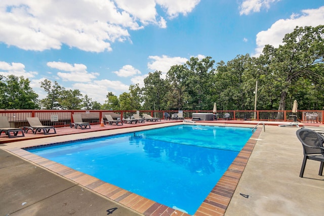 view of swimming pool with a patio