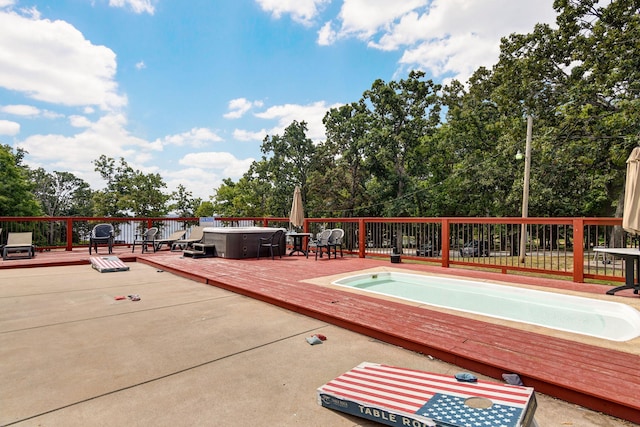 view of swimming pool featuring a deck