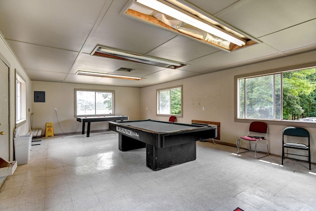 game room with electric panel and pool table