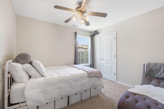 carpeted bedroom with ceiling fan