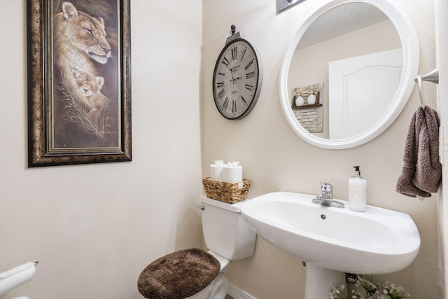 bathroom featuring sink and toilet