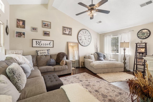 living room featuring dark hardwood / wood-style floors, high vaulted ceiling, beam ceiling, and ceiling fan