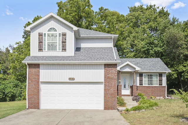 view of front of property featuring a garage and a front yard