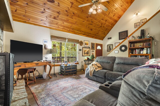 living room featuring wood ceiling, wood finished floors, high vaulted ceiling, and a ceiling fan