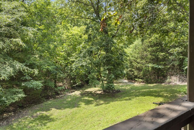 view of yard with a view of trees