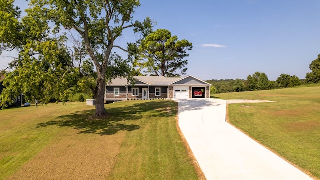 single story home with a front yard and a garage