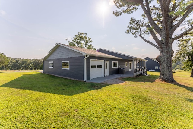 exterior space featuring a yard and a garage