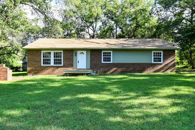 ranch-style home with a front yard