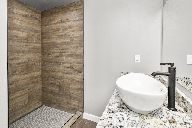 bathroom featuring a shower and sink