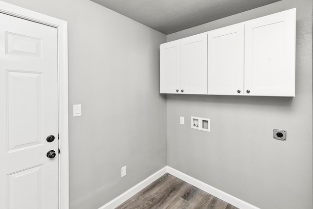 laundry room with hookup for a washing machine, dark hardwood / wood-style flooring, cabinets, and hookup for an electric dryer