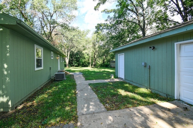 view of yard with central air condition unit