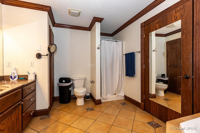 bathroom with crown molding, vanity, tile patterned flooring, and toilet