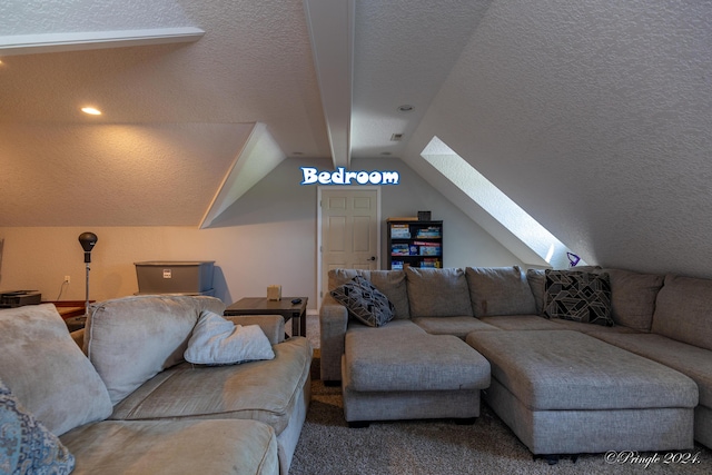 carpeted living room featuring vaulted ceiling with skylight and a textured ceiling