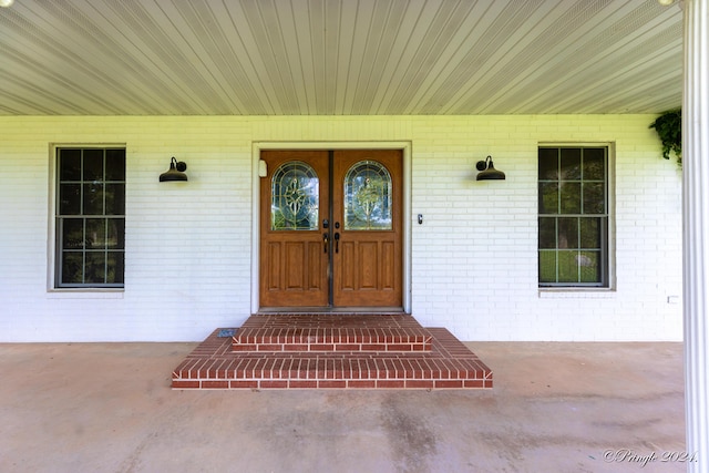 entrance to property with brick siding