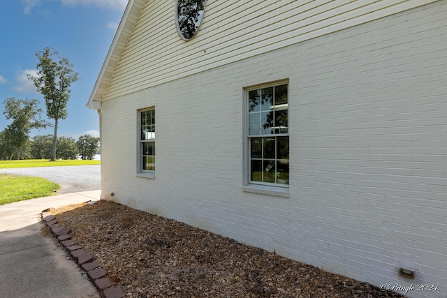 view of home's exterior with brick siding