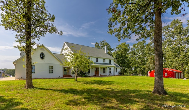 back of house featuring a lawn