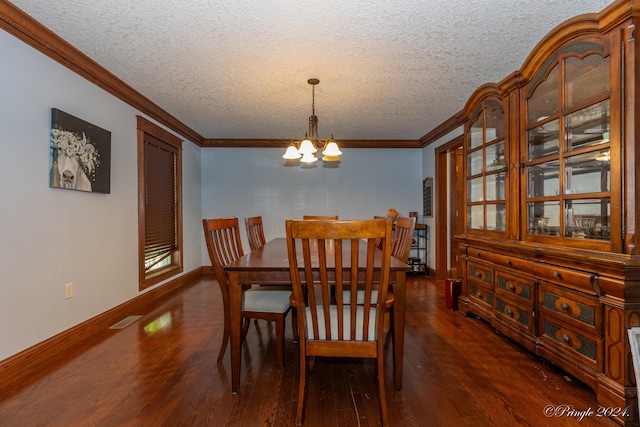 dining space featuring crown molding, visible vents, a chandelier, and dark wood-style flooring