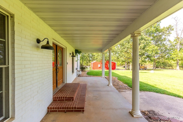 view of patio / terrace featuring an outbuilding