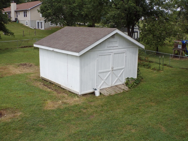 view of shed with fence