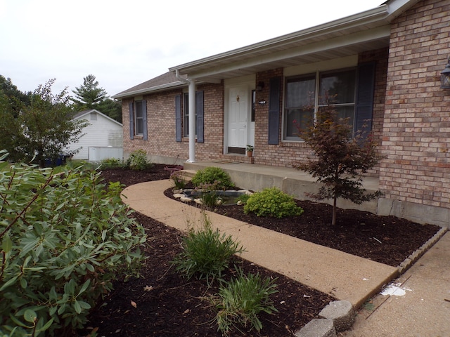 view of front of house featuring brick siding