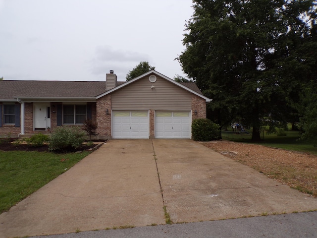 ranch-style home with a garage, concrete driveway, brick siding, and a chimney