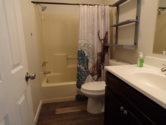 bathroom featuring vanity, shower / bath combo, wood finished floors, and toilet