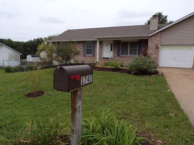 ranch-style house with a garage, a front yard, brick siding, and driveway