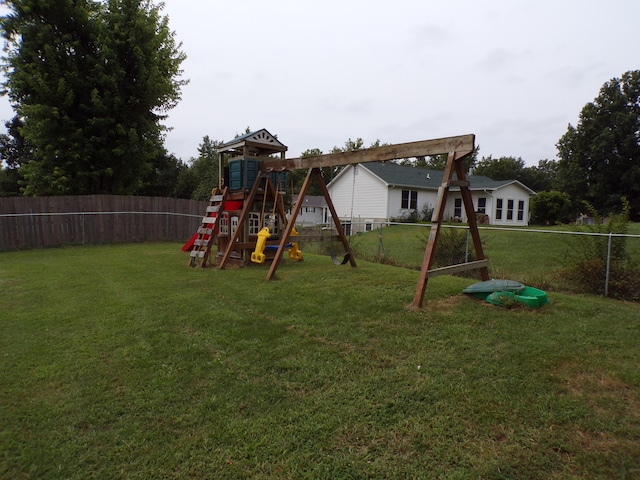 view of play area with a lawn and fence