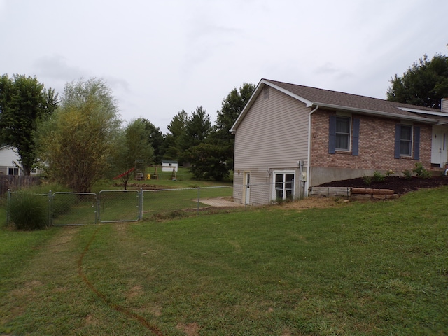 view of yard featuring a gate and fence