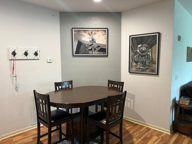 dining room featuring hardwood / wood-style floors